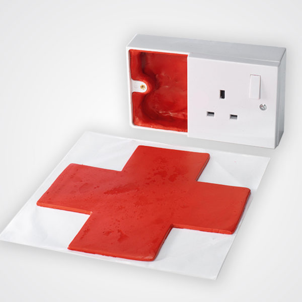 red fr putty pad fitted inside an electrical socket